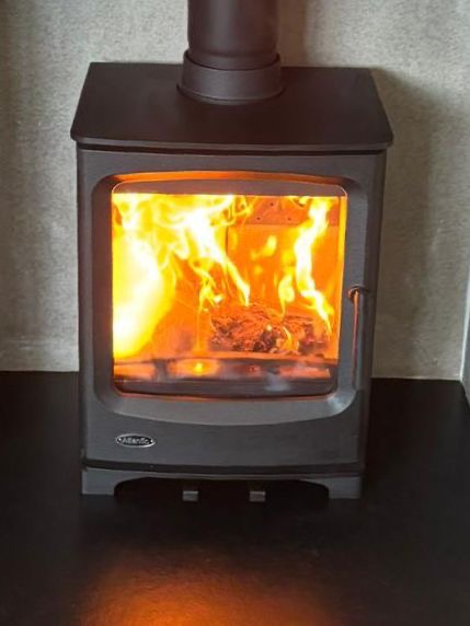 Woodford Carrington multi-fuel stove installed in a contemporary home interior, high-efficiency heating